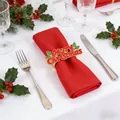 Merry Christmas napkin ring with red lettering and holly rhinestones on a red napkin - Merry Christmas Letters / Red