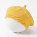 Detail view of a yellow knitted baby beret showing soft cotton texture and knit pattern - Yellow