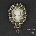 Vintage cameo brooch with sparkling rhinestones and red stones on dark backdrop - Deep Red Pendant Style (XD7569 Antique Gold)