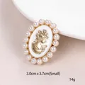 Vintage gold lady profile brooch with white enamel inlay and elegant pearl border. - Lady Portrait Pearl Style (XD10234-1)