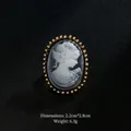 Vintage oval cameo brooch with female profile in gold-tone plated frame, 2.2x2.8cm - Grey Base White Sawtooth Border (XD7413-2)
