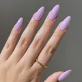 Premium glossy lavender purple almond shape press-on nails shown on a natural hand - Almond Shape / Glossy Purple (CDJ-20-32#1)