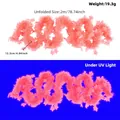 Two-meter long fluorescent pink star tinsel garland decoration with vibrant UV glow effect - Fluorescent Macaron Pink Star Garland