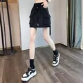 Black high-waisted cargo skort with adjustable drawstring and large side pockets for women - S / Bottoms / Black
