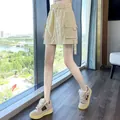 Khaki high-waist cargo skort with quick-dry fabric in a stylish A-line silhouette - S / Bottoms / Khaki