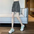Casual dark grey high-waisted cargo skort featuring functional side flap pockets - S / Bottoms / Dark Gray