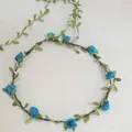 Elegant handmade floral crown with blue roses and green leaves for bridal hair accessories - Blue