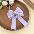 Detail of lavender lace bow hair clip with elegant pearl pendant - Purple