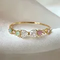 Dainty gold adjustable ring with colorful heart zircons on white silk background - Adjustable Open / Multicolor Zirconia Ring (JZ068)