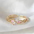 Elegant adjustable gold ring featuring pink and white zircons on white silk background - Adjustable Open / Pink Transparent Pear Shape (JZ066)