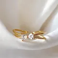 Elegant gold-plated adjustable ring with heart-shaped zircon bow-knot design for women. - Adjustable Open / Heart Transparent Zirconia (JZ064)