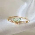 Elegant gold-plated adjustable ring featuring a butterfly motif with green zircon stones - Adjustable Open / Green Butterfly (JZ053)