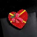 Red rhinestone heart-shaped Christmas gift box brooch with pink bow and green leaf detail. - YNCP2436 Heart Red Rhinestone
