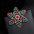 Festive Christmas snowflake brooch with vibrant red and green rhinestones on black box. - YNCP4751 Snowflake Colorful Rhinestone
