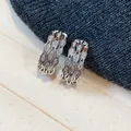 Elegant wavy U-shaped hoop earrings with sparkling cubic zirconia in silver finish. - 6 Silver Post (Wavy Layered Pave Zirconia Huggie) / Silver