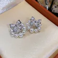 Elegant silver-plated bow knot earrings with sparkling zircons and delicate white pearls - 12 Silver Post (Bowknot Artificial Pearl Stud) / Silver