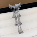 Elegant silver tassels earrings with zircon wing and teardrop charms for a luxury look. - 8 Silver Post (Angel Wing Tassel Drop) / Silver
