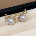Elegant gold plated bow-knot pearl earrings with sparkling zircon accent. - 53 Silver Post (Gold Bowknot Big Artificial Pearl) / Gold