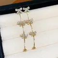 Elegant gold-plated dangle earrings with sparkling zircon bow motifs in a gift box - 39 Silver Post (Triple Bowknot Tassel) / Gold