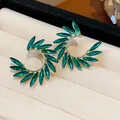 Elegant gold-plated U-shaped earrings featuring vibrant green marquise zircon leaves. - 51 Silver Post (Green Marquise Zirconia Huggie) / Gold-Green