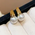 Elegant gold-plated U-shape earrings featuring round white pearls in jewelry box - 14 Silver Post (Artificial Pearl U-shaped Huggie) / Gold-Beige