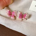 Elegant handmade pink beaded bow stud earrings with a gold-plated finish on silk fabric background - 36 Silver Post (Pink Gradient Bowknot Woven) / Gold-Pink