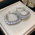 Elegant silver U-shaped hoop earrings featuring shimmering pave cubic zirconia stones - 16 Ear Ring (Silver Pave U-shaped Bag Design) / Silver