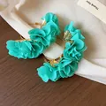 Elegant teal fabric flower hoop earrings with gold-plated accents for a unique look. - 26 Silver Post (Lake Green Gauze Flower) / Gold-Green