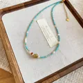 Ethno-Halskette mit Natursteinen, Türkis- und Perlenakzenten im Retro-Stil. - Herz-Anhänger-Stil (13#) / Blau