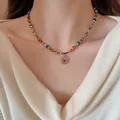 Boho-Halskette mit Natursteinen und einem goldfarbenen Sonnenanhänger im Ethno-Stil - Sonnenanhänger-Stil (15#) / Gold