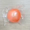 Pelota antiestrés rellena de jarabe de malta naranja en envoltorio de plástico - 6cm / Naranja Perlado