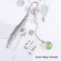 Elegant silver metal feather bookmark featuring a green dried flower glass ball pendant - Green Gypsophila
