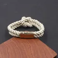 Elegant woven cream PU leather rope bracelet featuring a polished gold magnetic clasp - Off White