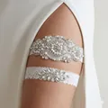 Elegant bridal garter set with sparkling rhinestones and delicate pearls on white lace. - Artificial Pearl Flower Rhinestone 2-Piece Set (GS-J021)