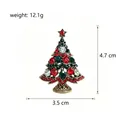 Close-up view of a rhinestone Christmas tree brooch showing 4.7 x 3.5 cm dimensions. - Retro Gold Base Red Green Rhinestone (XZ090-A)
