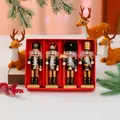 Detailed set of 4 wooden nutcracker figurines in a festive red gift box for Christmas decor. - Black and Gold Nutcracker 4-Piece Set