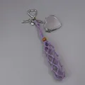 Detail view of purple woven lipstick holder with silver heart-shaped mirror and charms - Woven Style with Heart Mirror / Purple