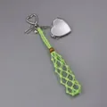 Detail view of green hand-woven net lipstick holder with silver heart mirror keychain - Woven Style with Heart Mirror / Green