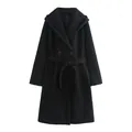 Detailed front view of a stylish black hooded wrap coat featuring a matching tie waist belt. - XS / Tops / Black