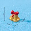 Miniature golden Christmas bell ornament with a red bow, size 2cm x 2.1cm x 1.4cm - Bell (C0518) / 1 Piece