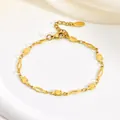 Detailed close-up of a gold stainless steel bracelet with geometric diamond links - Diamond / Gold