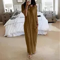Casual solid brown short sleeve maxi dress with pockets shown in bedroom mirror selfie - Earthy Yellow