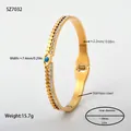 Gouden roestvrijstalen armband met boos oog en kristallen, binnendiameter 59mm. - Gekartelde Rand Boze Oog Stijl (SZ7032) / Goud