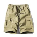 Classici pantaloncini cargo kaki larghi da uomo con elastico in vita e grandi tasche - XS / Bottoms / verde chiaro