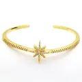 Elegant gold cuff bracelet with a sparkling crystal-encrusted starburst center detail. - Hexagram Style (712) / Gold