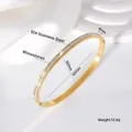 Close-up detail of a gold 304 stainless steel bangle with sparkling rhinestones and dimensions - Single Row / 4mm (50*60) / Gold
