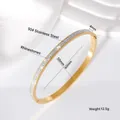 Dettaglio del bracciale rigido in acciaio inox 304 dorato con strass brillanti e dimensioni - 4 Mm Color Oro [doppia Fila Di Strass 50*60]