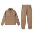 Detailed view of solid khaki two-piece tracksuit set with quarter-zip pullover and jogger pants - Camel