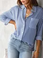Close-up detail of women's casual blue and white vertical striped long-sleeved shirt - S / Tops / Royal Blue