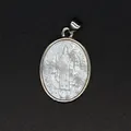 Detailed macro view of a vintage religious saint carving on a natural mother of pearl shell - St. Benedict Carved Style (aljylp1797) / Silver